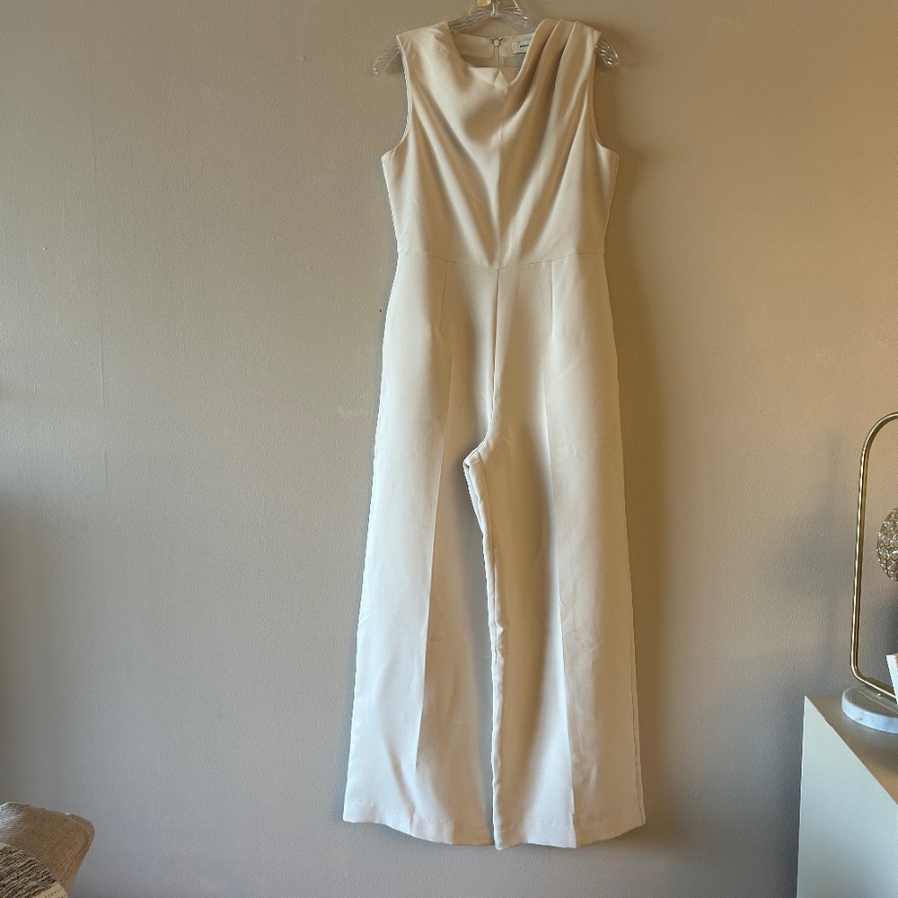 One piece cowel neck jumpsuit. Wide legs with pockets.